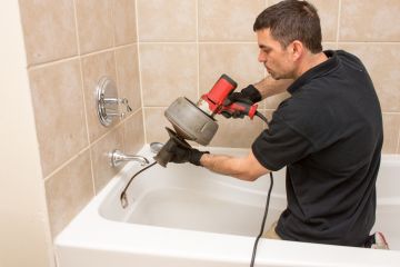 Master Pro Plumber Snaking a Clogged Drain in Des Plaines